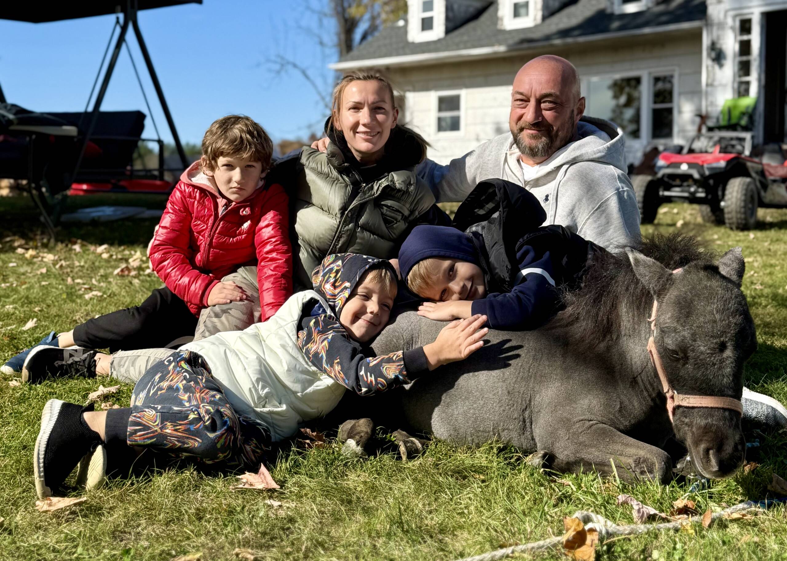 Yan and Nataliya Chertok with their children and miniature horse at Marlboro Meadows Farm in Marlboro NJ